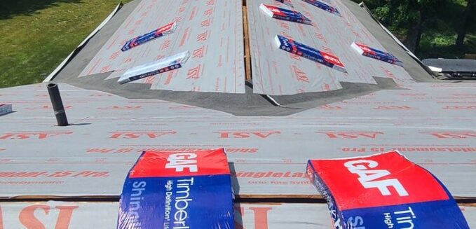 packs of shingles on a roof top